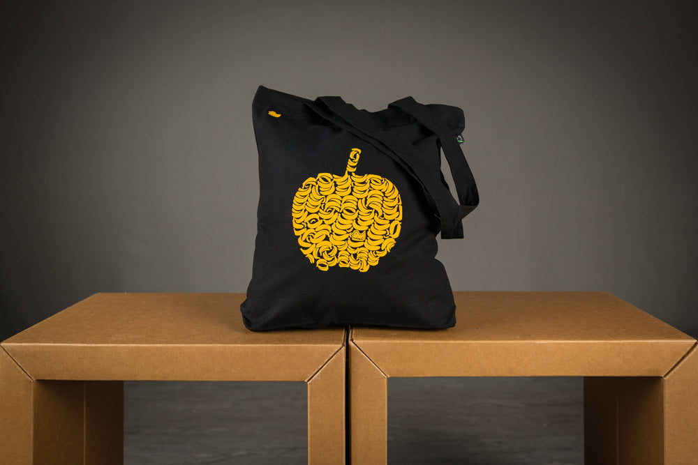 Fruchtiger Apfel Jutebeutel in schwarz Motiv aus Bananen in Gelb mit Aufdruck Tasche Beutel aus Biobaumwolle  -  flauschiges Flock Motiv