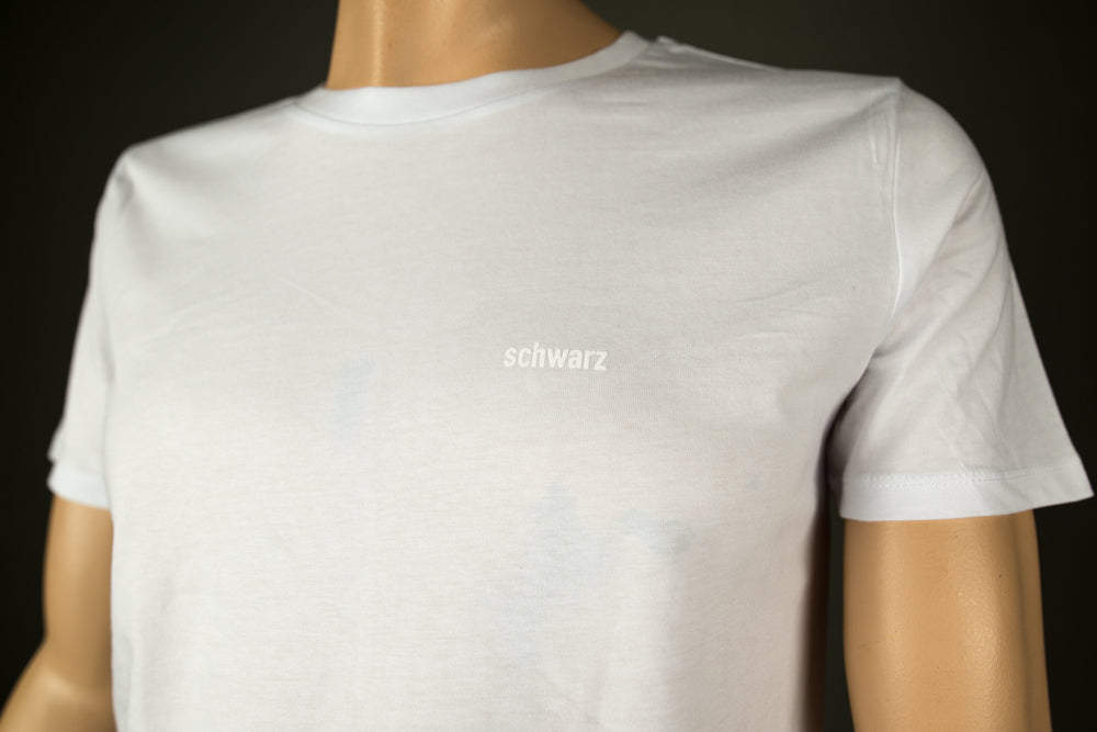 Schwarzes T-Shirt für Männer aus Biobaumwolle mit minimalistischem Brustlogo aus Flock in weiss motto shirt