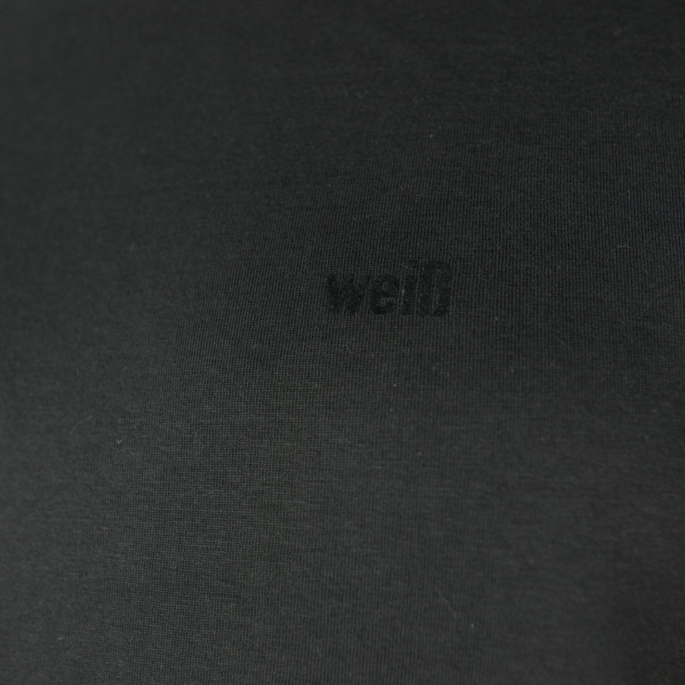 
                  
                    Weisses T-Shirt für Männer aus Biobaumwolle mit minimalistischem Brustlogo aus Flock schwarz
                  
                