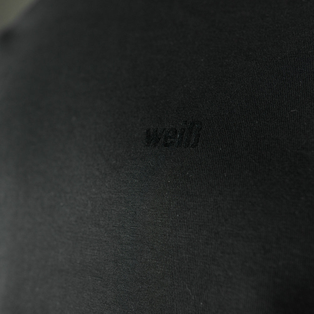 
                  
                    Weisses T-Shirt für Männer aus Biobaumwolle mit minimalistischem Brustlogo aus Flock schwarz
                  
                